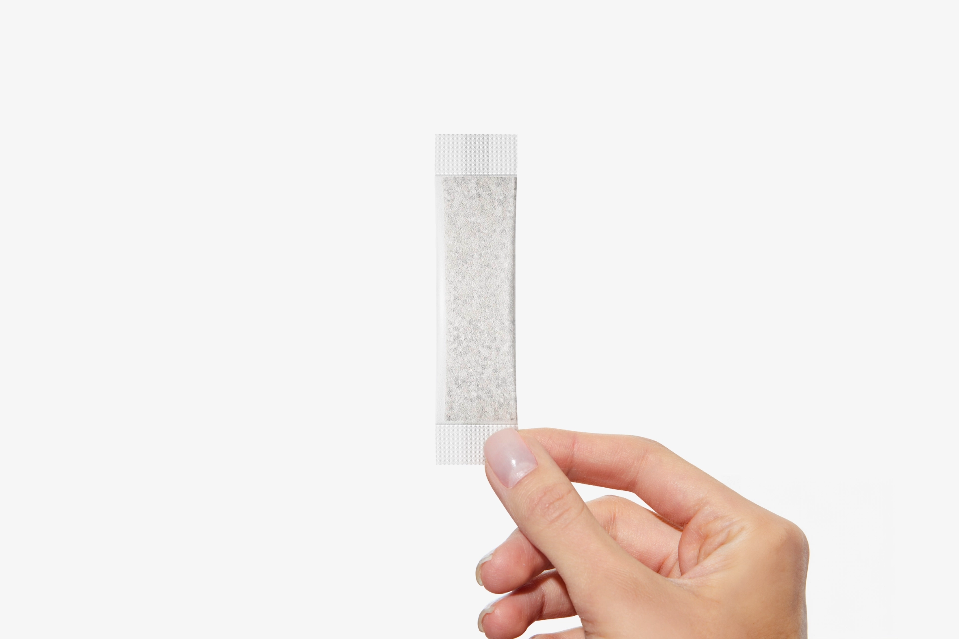 Holding a Coral-Mine stick sachet
